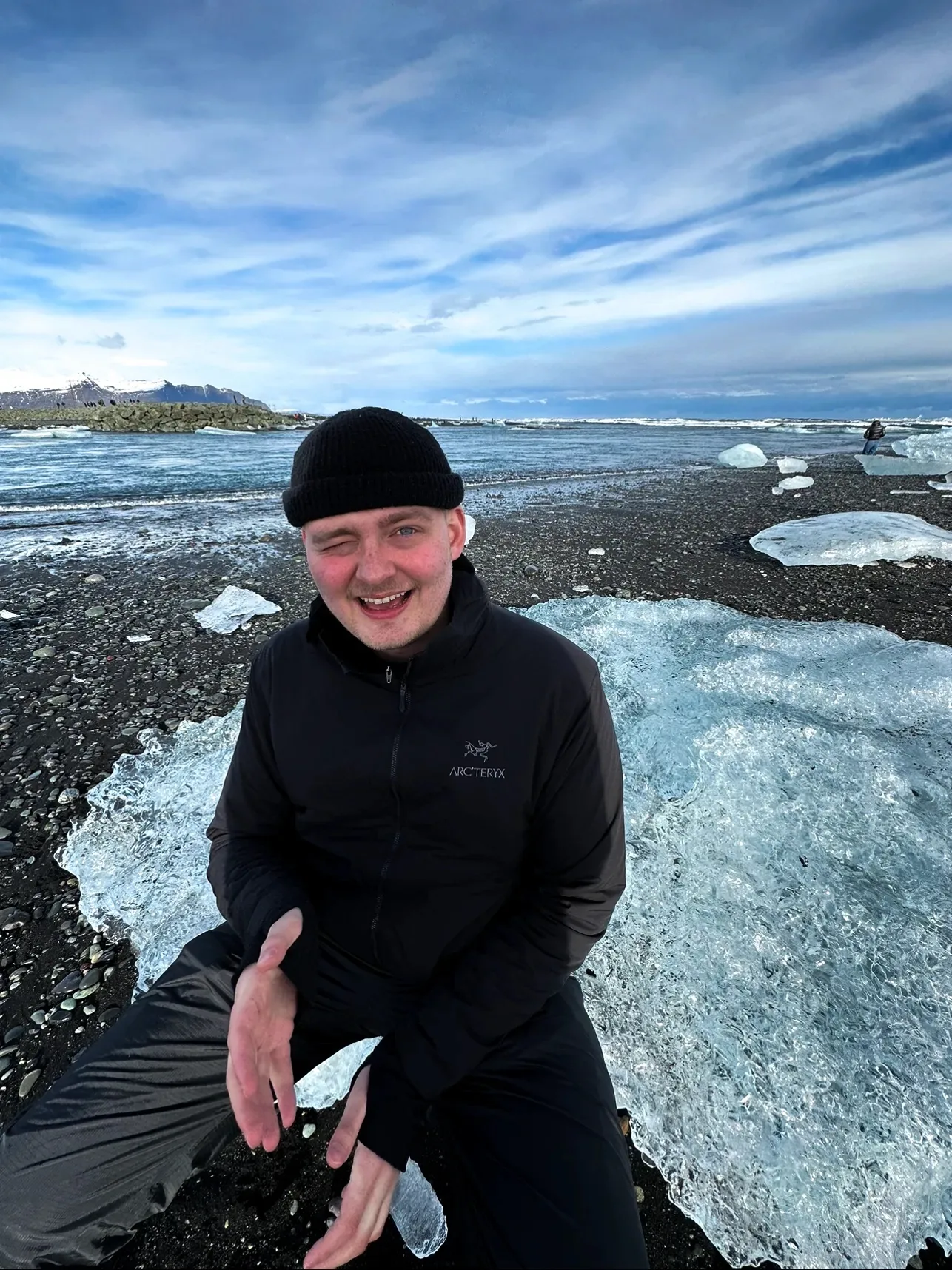Devan Sweet on a black-sand beach in Iceland
