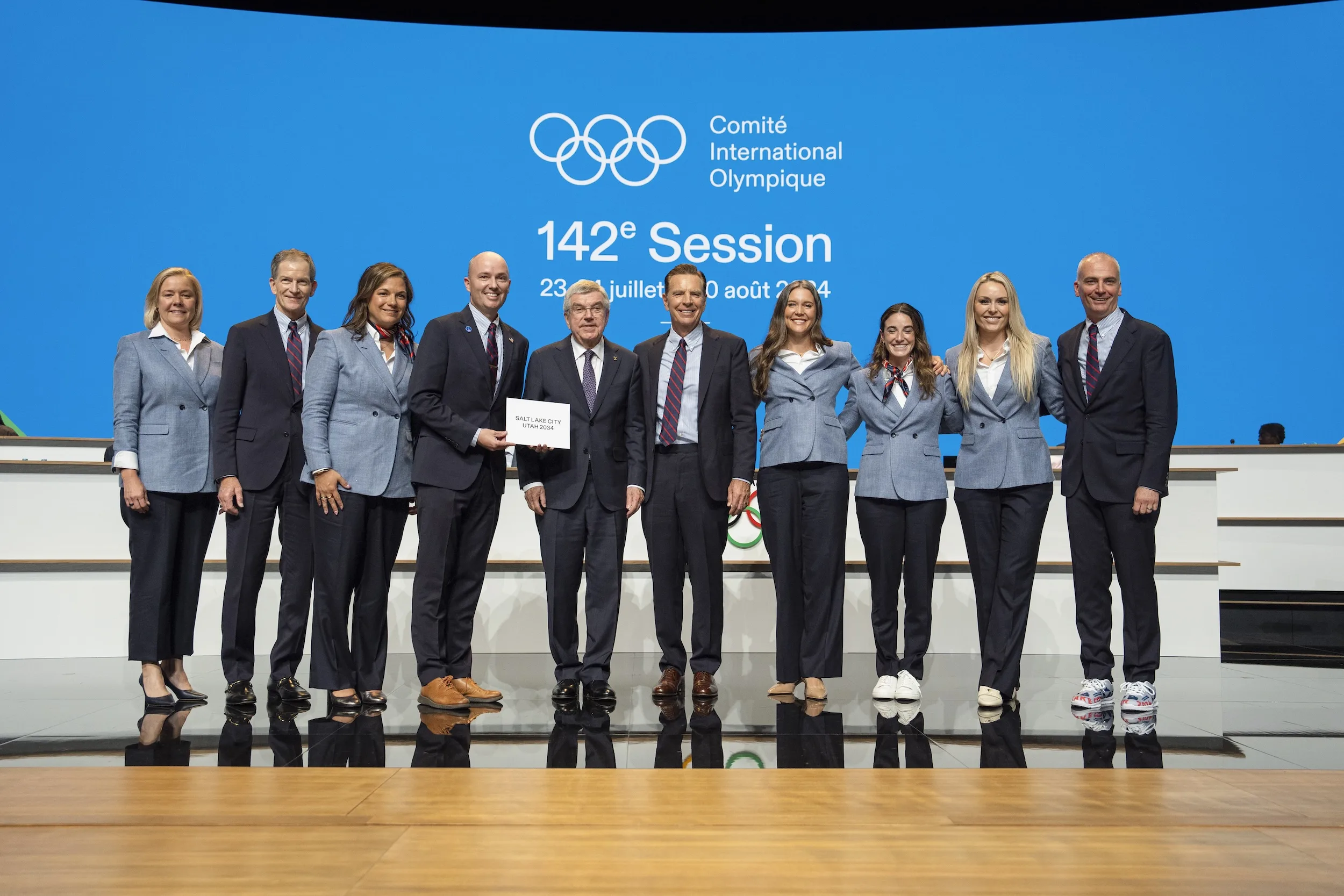 The full delegation holding the Salt Lake City Utah 2034 announcement card